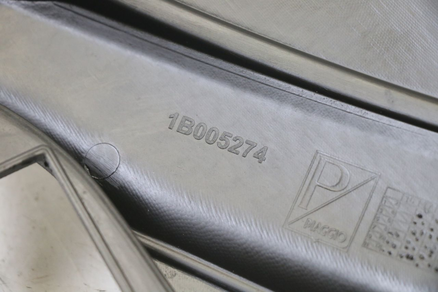 photo de TAPA BAJO ASIENTO IZQUIERDA APRILIA SR 2T 50 (2018 - 2022)